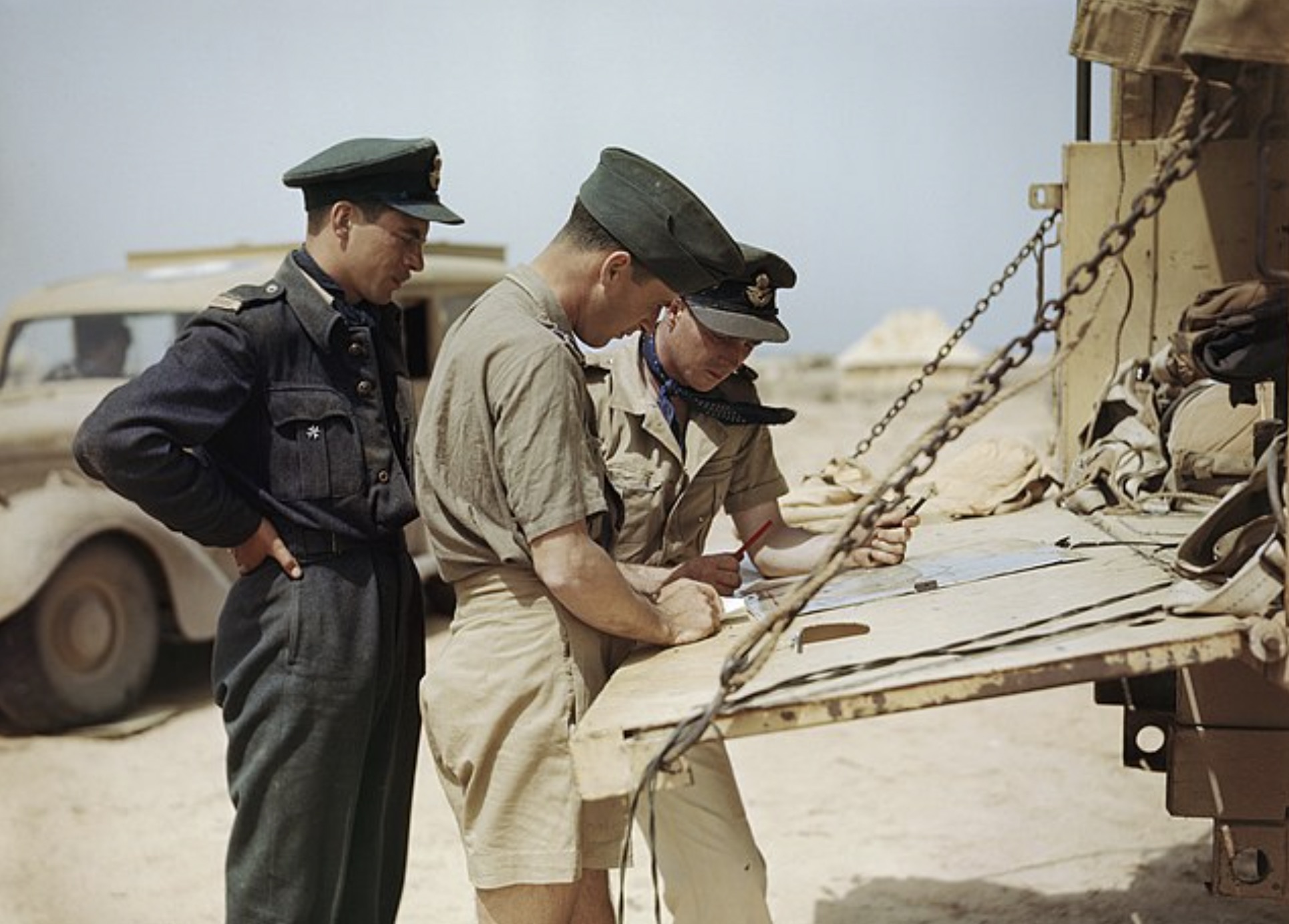 Spitfire pilots of No. 417 Squadron, Royal Canadian Air Force, planning another operation from their airfield at Goubrine in Tunisia.